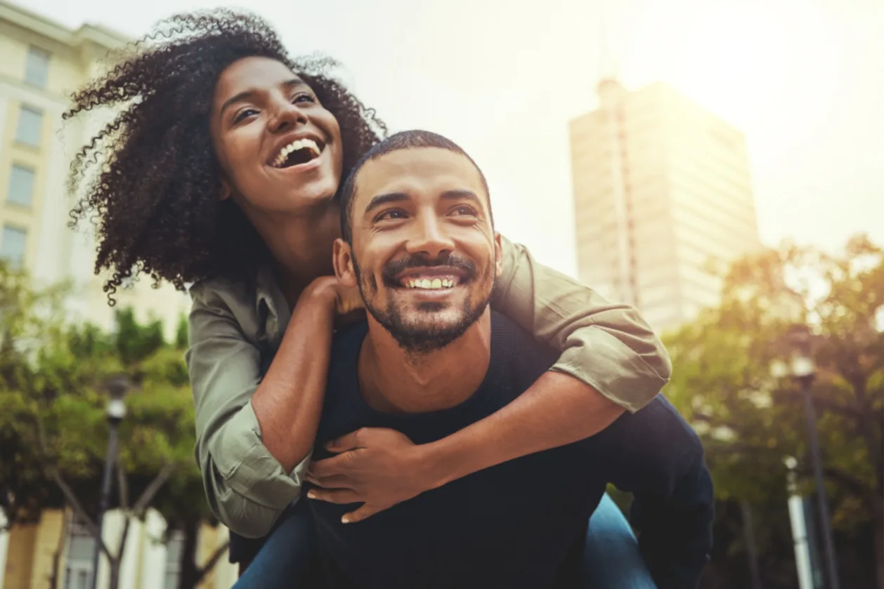 young couple in love piggyback ride